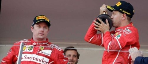Kimi Raikkonen can't hide his disappointment as Sebastian Vettel beats him to Monaco glory. (Source: sportsnet.ca)