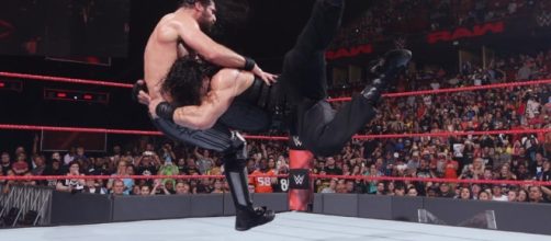Roman Reigns hits a Spear on his Shield brother Seth Rollins on RAW/Photo via WWE