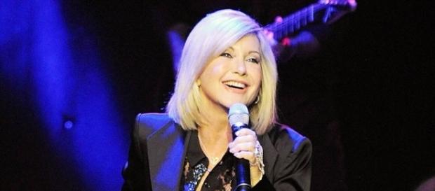 Olivia Newton-John postpones tour dates due to cancer. / from 'Fire News Feed' - firenewsfeed.com Olivia Newton-John postpones tour dates due to cancer. / from 'Fire News Feed' - firenewsfeed.com