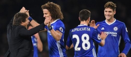 Chelsea celebrating following their 3-0 win- mirror.co.uk