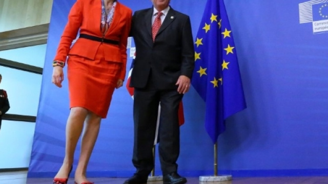 Theresa May steps out in red-lipped shoes after her calls to ... - thesun.co.uk