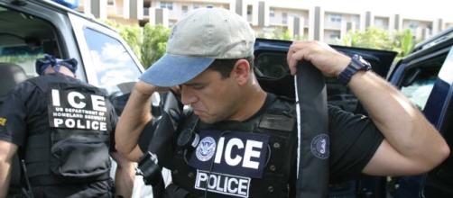 US ICE agents/ photo courtesy of Wikimedia Commons/ https://commons.wikimedia.org/wiki/File:US_Immigration_and_Customs_Enforcement_SWAT.jpg
