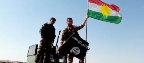 Peshmerga throw away the ISIS flag and hang up the Kurdish… | Flickr - flickr.com