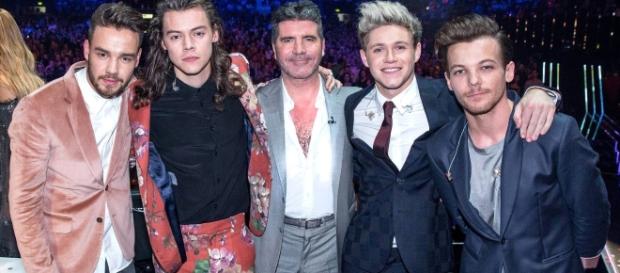 One Direction with mentor Simon Cowell / Photo via One Direction , Facebook One Direction with mentor Simon Cowell / Photo via One Direction , Facebook
