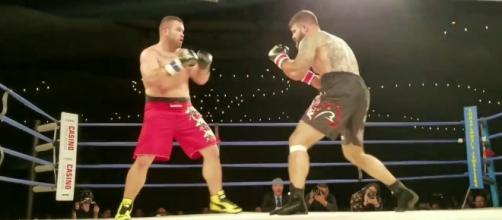 Tim Hague (left) died after his bout against Adrian Braidwoods. [Image via YouTube/MMA News]