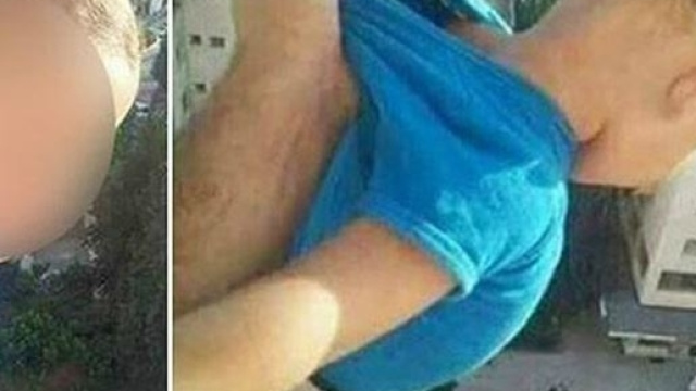 Foto di bambino sospeso nel vuoto da un parente: sfida, provocazione con minaccia su Facebook: "Mettete 1000 like o lo butto giù".
