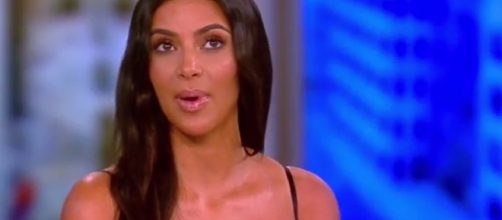 Kim Kardashian responded to Twitter backlash following black face beauty campaign image. Image via YouTube/TheView
