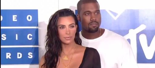 Kanye West and Kim Kardashian hire surrogate for third child. Image via YouTube/Entertainment Tonight
