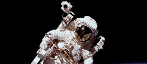 NASA Space Suit in Use (Courtesy NASA)