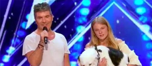 Simon Cowell stands up to appeal for a talented dog and the training of his mistress on "America's Got Talent"--AGT/YouTube
