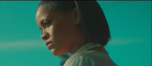 Singer Rihanna was recently seen making out in a pool with a mystery man stirring up fans' curiosity. [Image via Rihanna VEVO/YouTube]