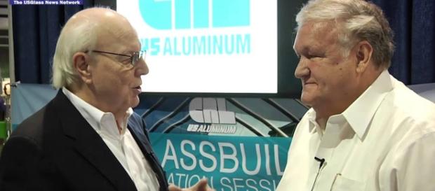 Lyle Hill talks with Donald Friese of C.R. Laurence. Photo via USGlassMag, YouTube. Lyle Hill talks with Donald Friese of C.R. Laurence. Photo via USGlassMag, YouTube.