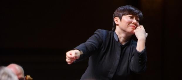 “Violins, I want more vibration,” says Xian Zhang, with her left hand. Photo: Fred Stucker, New Jersey Symphony Orchestra, used with permission. “Violins, I want more vibration,” says Xian Zhang, with her left hand. Photo: Fred Stucker, New Jersey Symphony Orchestra, used with permission.
