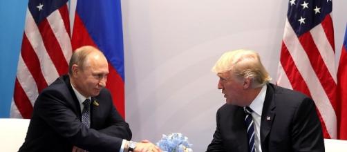 Donald Trump and Vladimir Putin shake hands at the G20 summit in Hamburg, Germany (Source: Kremlin)