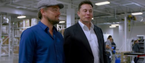 Elon Musk attended a beach party wearing a suit with actor Leonardo DiCaprio. Source: National Geographic/Youtube Screenshot