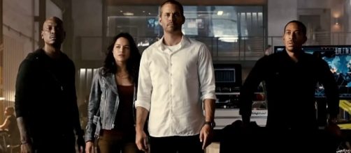 Photo Paul Walker and the cast of "Furious 7" screen capture from YouTube video/Wiz Khalifa