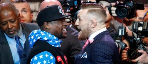 Like two pro-wrestlers cutting promos, Mayweather and McGregor face off in 'Money Fight' press con. / [Image source: Pixabay.com]