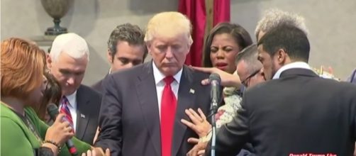 Christians praying over Donald Trump. Photo via Susan Jenkins, YouTube.