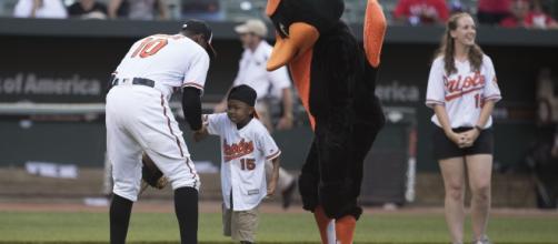 Zion Harvey throwing out the ceremonial first pitch.