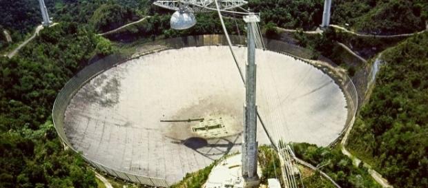 The Arecibo Radio Telescope, at Arecibo, Puerto Rico by H. Schweiker/WIYN and NOAO/AURA/NSF via Wikimedia Commons The Arecibo Radio Telescope, at Arecibo, Puerto Rico by H. Schweiker/WIYN and NOAO/AURA/NSF via Wikimedia Commons