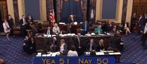 US Senate voting 51-50 in favor of the motion proceed with debate- (YouTube/Time)