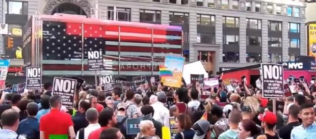 Protesters flood Times Square in demo against Trump's transgender service ban- Image - RT UK | YouTube Protesters flood Times Square in demo against Trump's transgender service ban- Image - RT UK | YouTube