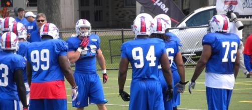 Marcell Dareus huddles with defense in training camp Photo Credit: D. Nadolski