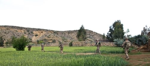 US troops survey the countryside in Afghanistan.https://pixabay.com/en/troopers-troops-soldiers-fields-60770/