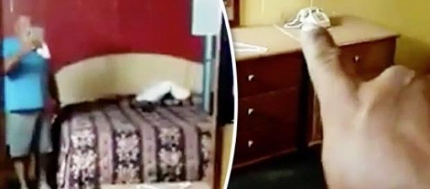 Homem grava vídeo de suporto fantasma Homem grava vídeo de suporto fantasma