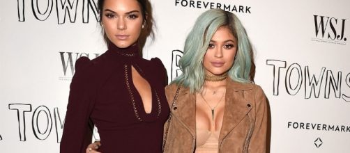 Kylie and Kendall Jenner pull out vintage t-shirts from their website.