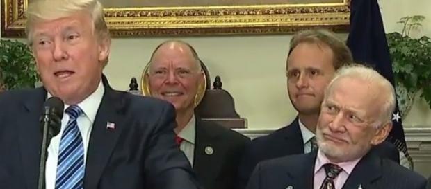 Buzz Aldrin's puzzled looks steal the show from behind Trump. Photo: YouTube Screenshot Buzz Aldrin's puzzled looks steal the show from behind Trump. Photo: YouTube Screenshot
