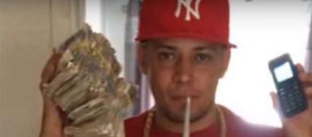 Image by jorge vermaak/YouTube screencap. 'Untouchable' Liam Wall, Cardiff drug dealing gang leader, posing with drug money. Image by jorge vermaak/YouTube screencap. 'Untouchable' Liam Wall, Cardiff drug dealing gang leader, posing with drug money.