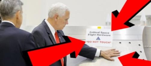 Mike Pence at NASA is doing what the 'Do not touch' sign says not to! Image credit: YouTube screencap Via Tech Tube