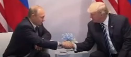 Trump and Putin meet and shake hands ahead of meeting at the G20 (Image credit Business Insider / Youtube