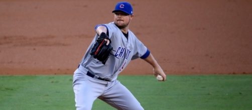 Cubs starter Jon Lester delivers a pitch during the first inning of #NLCS Game 5 by author	Arturo Pardavila III via Wikimedia Commons