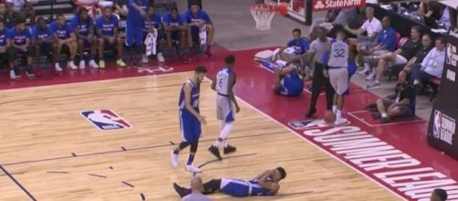 Sixers rookie Markelle Fultz stays on the court following a bad landing in the third quarter. [Image via NBA/YouTube]