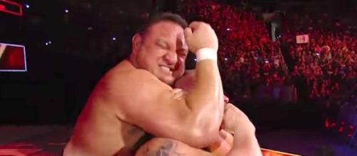 Will Samoa Joe lock the Coquina Clutch on Brock Lesnar this Sunday to win the title? [Image via WWE/YouTube]