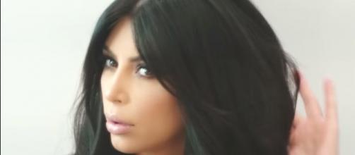 Kim Kardashian's company is facing a lawsuit over a selfie case. [Photo via Kim Kardashian West/YouTube