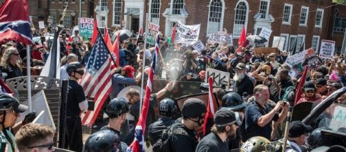 White supremacists protesters brawling against counter-protesters and law enforcement. (Image via cnn.com)