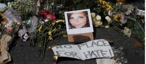 Heather Heyer's photograph is shown with a message and bunches of flowers (Facebook).