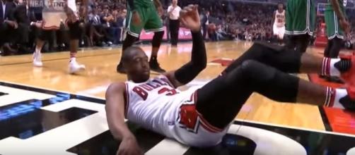 Dwayne Wade falling down after scoring against the Boston Celtics (c) https://www.youtube.com/channel/UCOvzkEPgZ5RrabEF1hr3UEw