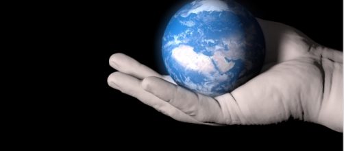 We only have one planet to care for, so why aren't we caring enough? (Image Credit: Our Planet On A Palm via Public Domain Pictures)