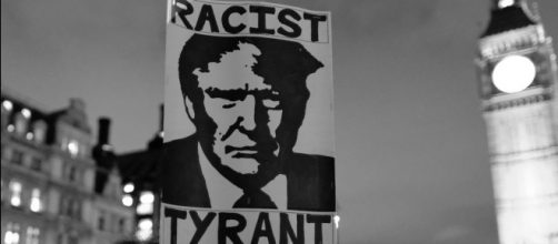Trump sign at protest in England. / [Image by Alisdare Hickson via Flickr, CC BY-SA 2.0]