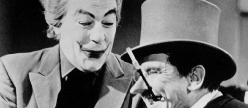Cesar Romero (L) as the first live-action Joker, in the 'Batman' 60s TV series. / from 'Wikimedia Commons' - commons.wikimedia.com