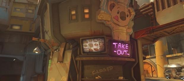 The signage in a Junkertown restaurant reads "take out," which is a common American expression. (Gamespot/Blizzard) The signage in a Junkertown restaurant reads "take out," which is a common American expression. (Gamespot/Blizzard)