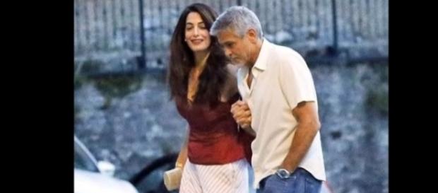 George and Amal Clooney were spotted at Lake Como, Italy with some friends. Image via YouTube/EasyTech George and Amal Clooney were spotted at Lake Como, Italy with some friends. Image via YouTube/EasyTech