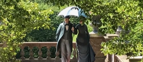 Two life-like sculptures seeming strolling along at Old Westbury Gardens. / Photo via the Seward Johnson Atelier, used with permission.