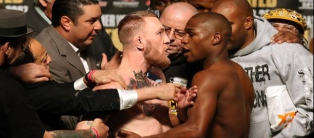 McGregor (left) predicts he will KO Mayweather (right) on the 2nd round. Image credit - Fight Focus/YouTube McGregor (left) predicts he will KO Mayweather (right) on the 2nd round. Image credit - Fight Focus/YouTube