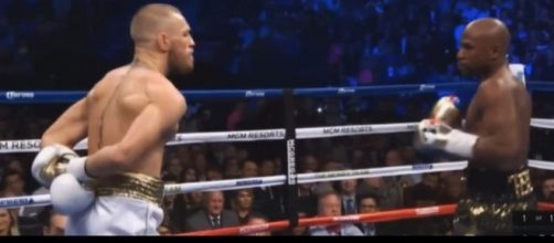 Conor McGregor taunting Floyd Mayweather in round 1. Mayweather would beat him later by TKO. / from 'YouTube' screen grab