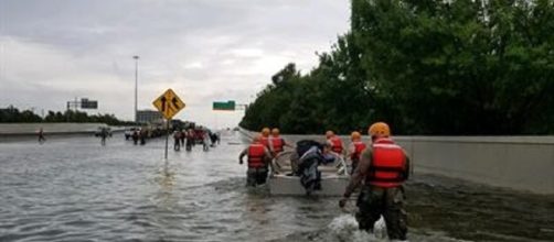 National Guardsmen slog through a flooded Houston road (Defense Department)